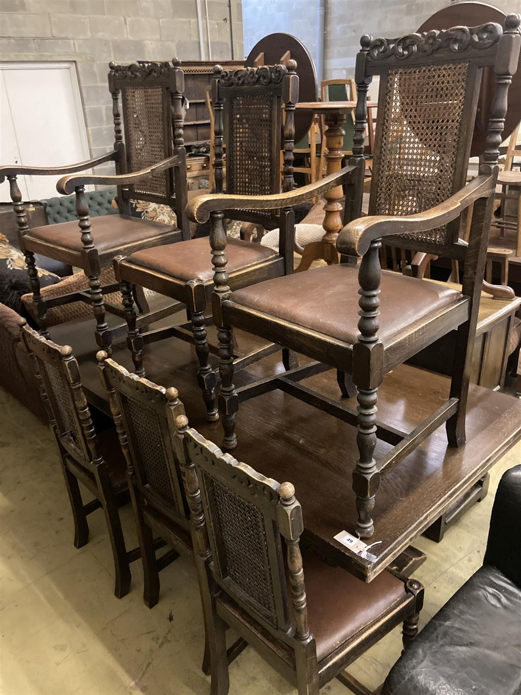 An 18th century design oak draw leaf dining table, 270cm extended width 92cm height 77cm, together with a set of six caned oak dining c